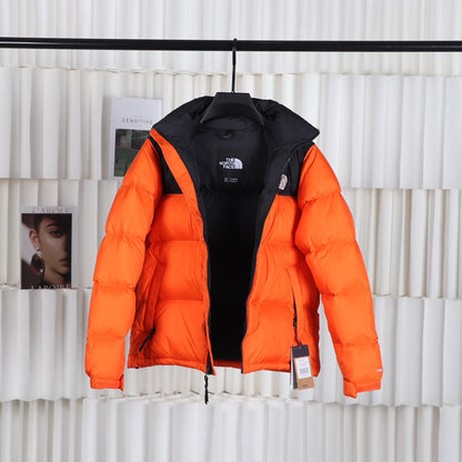 The North Face 1996 Retro Nuptse Orange Puffer Jacket for Cold Weather