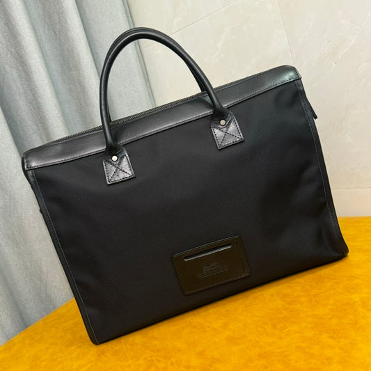 Hermès Black Canvas Briefcase With Leather Trim And Buckle Closure