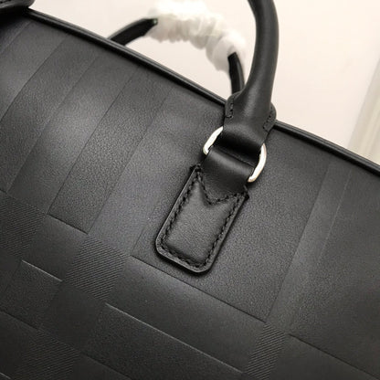 Sleek Black Burberry Briefcase With Woven Texture For Sophisticated Business And Travel Looks
