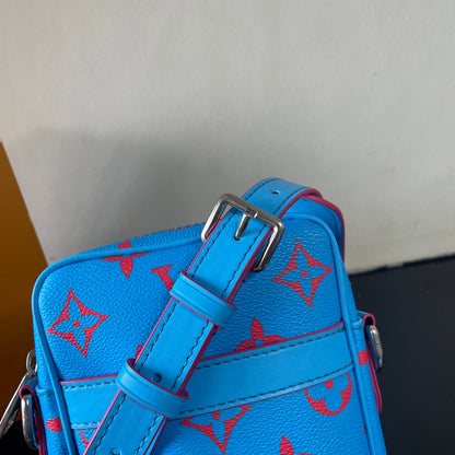 Eye Catching Blue Louis Vuitton Crossbody Bag With Red Monogram Pattern And Adjustable Strap