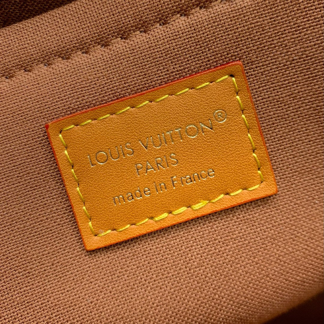 Classic Louis Vuitton Monogram Messenger Bag With Tan Leather Accents And Buckles