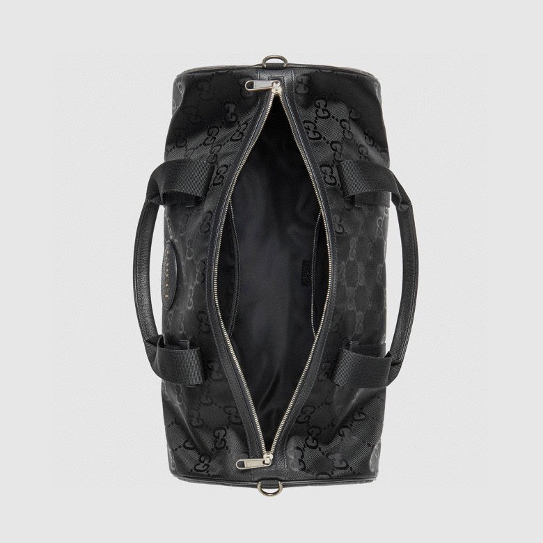 Elegant Black Gucci Duffle Bag With Signature GG Pattern And Gold Branding 658632