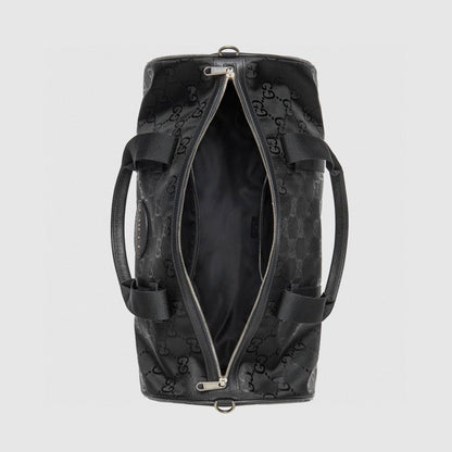 Elegant Black Gucci Duffle Bag With Signature GG Pattern And Gold Branding 658632