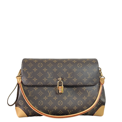 Classic Louis Vuitton Monogram Canvas Handbag With Lock Detail And Stylish Design