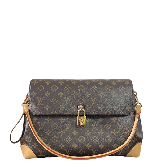 Classic Louis Vuitton Monogram Canvas Handbag With Lock Detail And Stylish Design