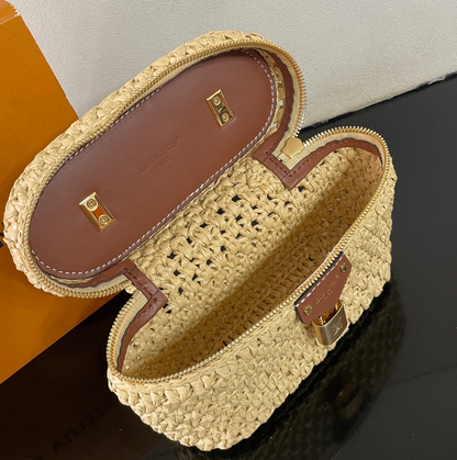 Chic Louis Vuitton Woven Straw Vanity Bag With Leather Handle And Lock Accents