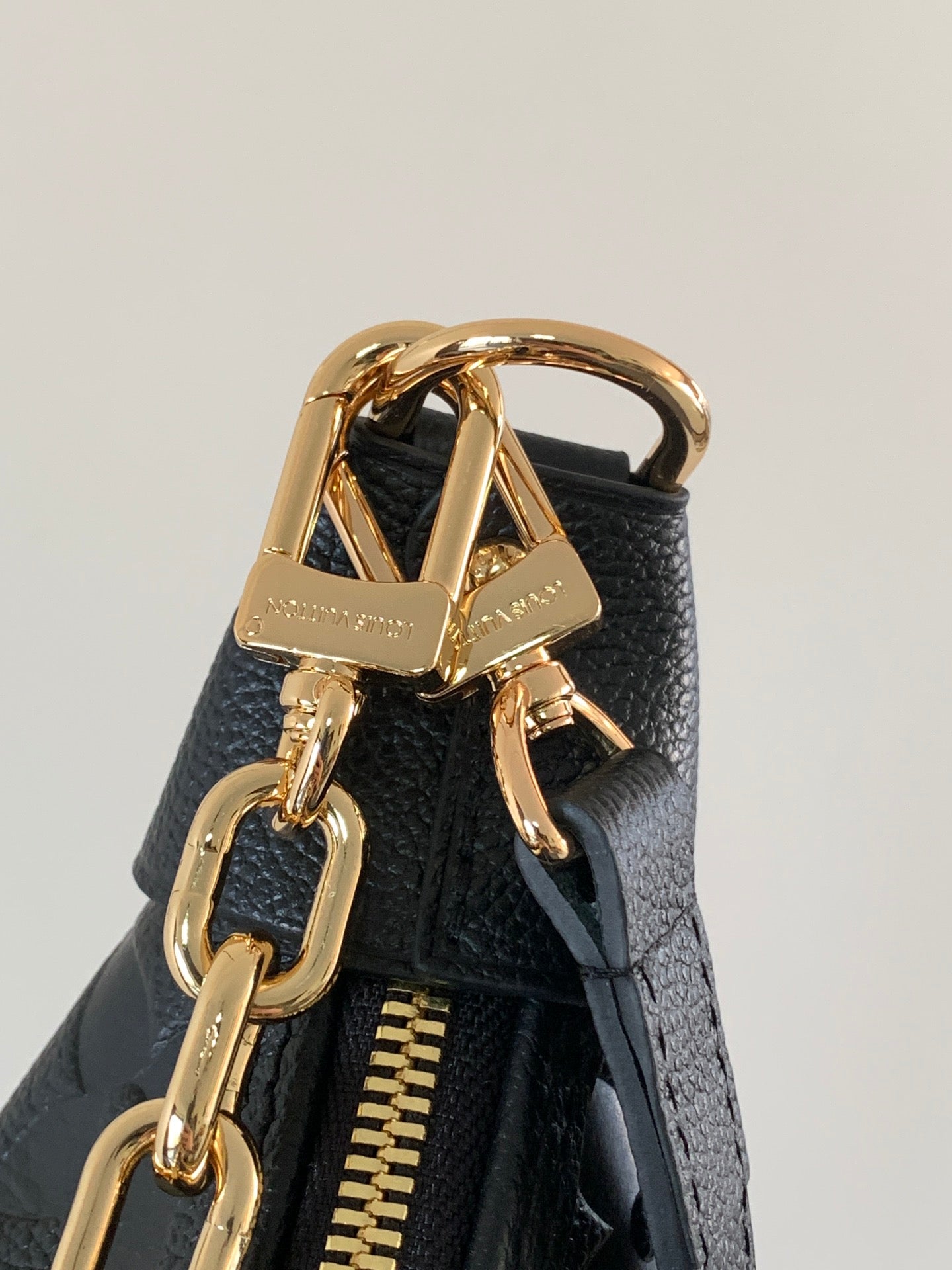 Louis Vuitton Black Embossed Leather Moon Bag With Gold Chain Stylish Luxury Shoulder Accessory
