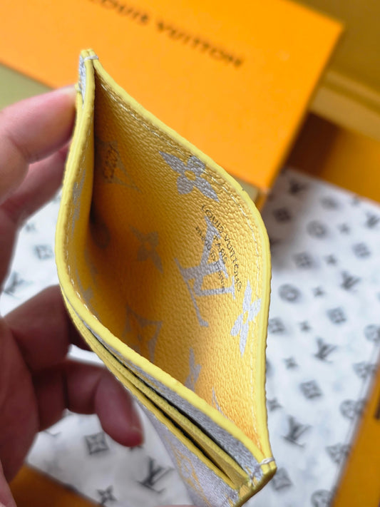 Chic Louis Vuitton Light Blue Card Holder with Gold Monogram and Yellow Accent M14771
