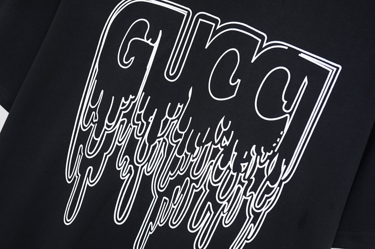 Gucci Cream/Black Tee With Dripping Logo Design For Edgy Fashion Aficionados
