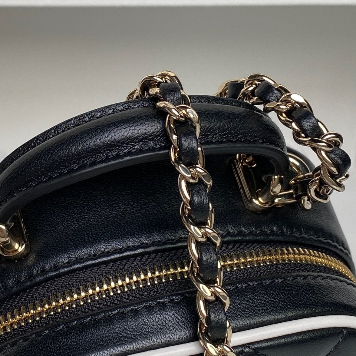 Chanel Quilted Black Leather Mini Backpack with White Trim and Gold - Tone Chain Straps AP4514