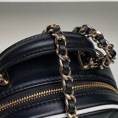 Chanel Quilted Black Leather Mini Backpack with White Trim and Gold - Tone Chain Straps AP4514
