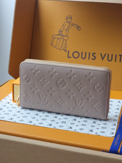 Elegant Louis Vuitton Black Embossed Leather Zip Around Wallet With Gold Accents