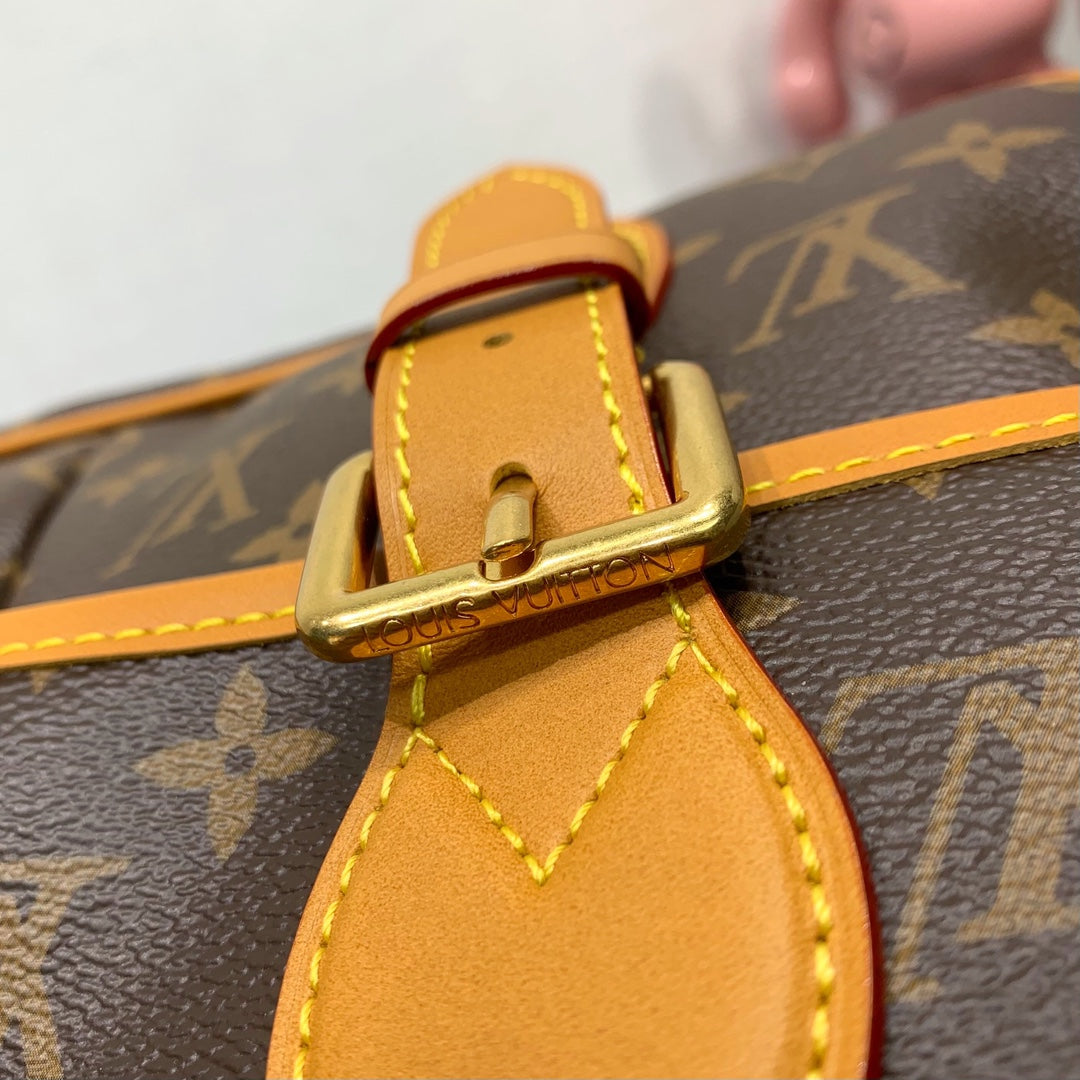Classic Louis Vuitton Monogram Messenger Bag With Tan Leather Accents And Buckles