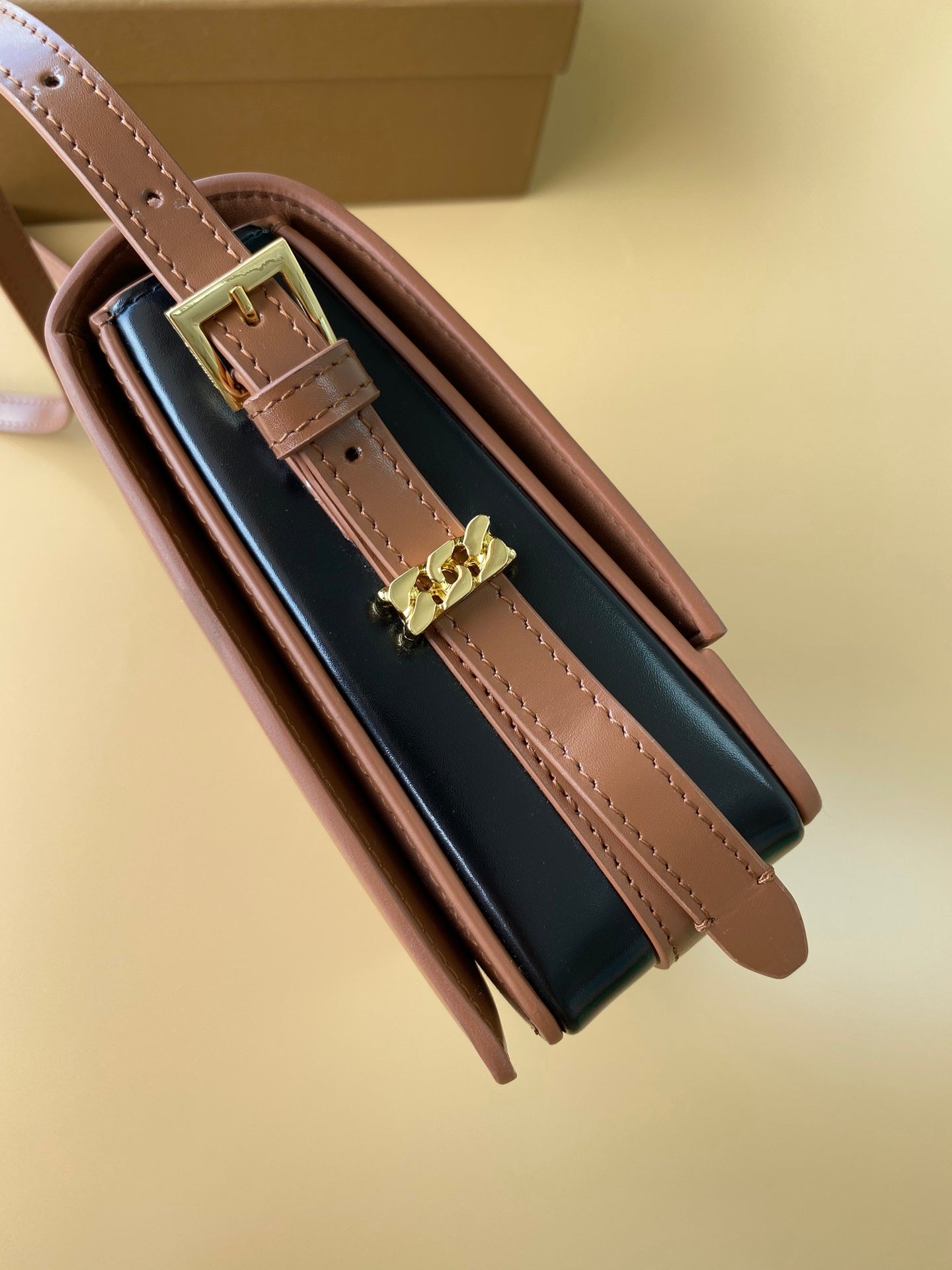 Elegant Black/Brown Burberry Crossbody Bag With Gold Branding And Adjustable Strap Style No.595155