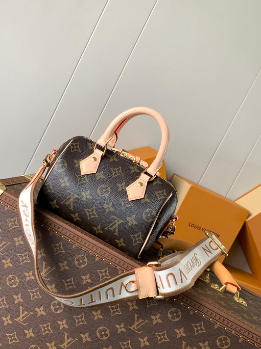 Louis Vuitton Speedy Bandoulière Bag With Colorful Charms And Stylish Strap For Fashion Enthusiasts