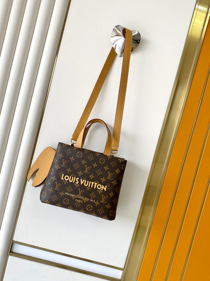 Elegant Louis Vuitton Monogram Canvas Tote Bag With Leather Handles And Gold Branding