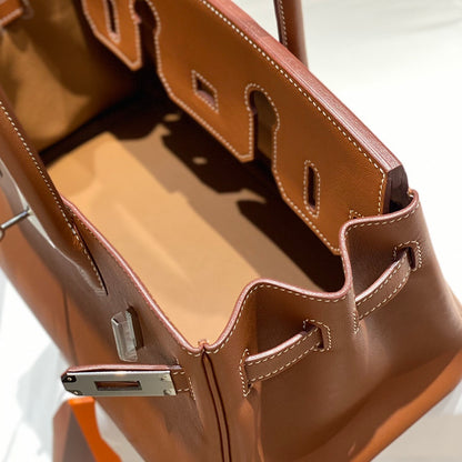 Timeless Hermès Birkin Bag in Classic Brown Leather with Silver Hardware 169