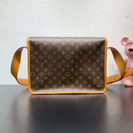 Classic Louis Vuitton Monogram Messenger Bag With Tan Leather Accents And Buckles