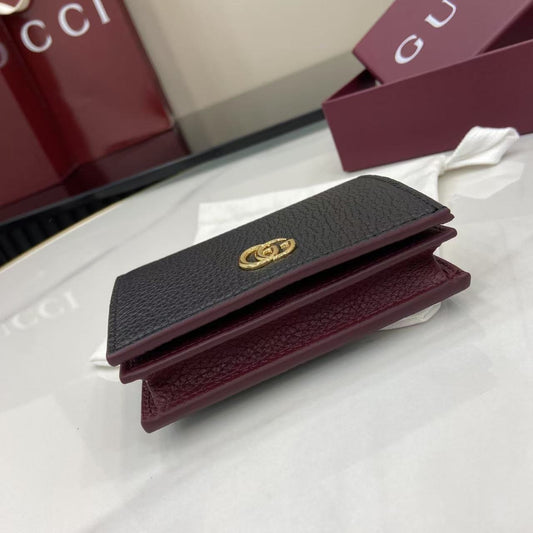 Elegant Black Gucci Wallet With Iconic Gold GG Logo For Timeless Luxury Accessory 456126