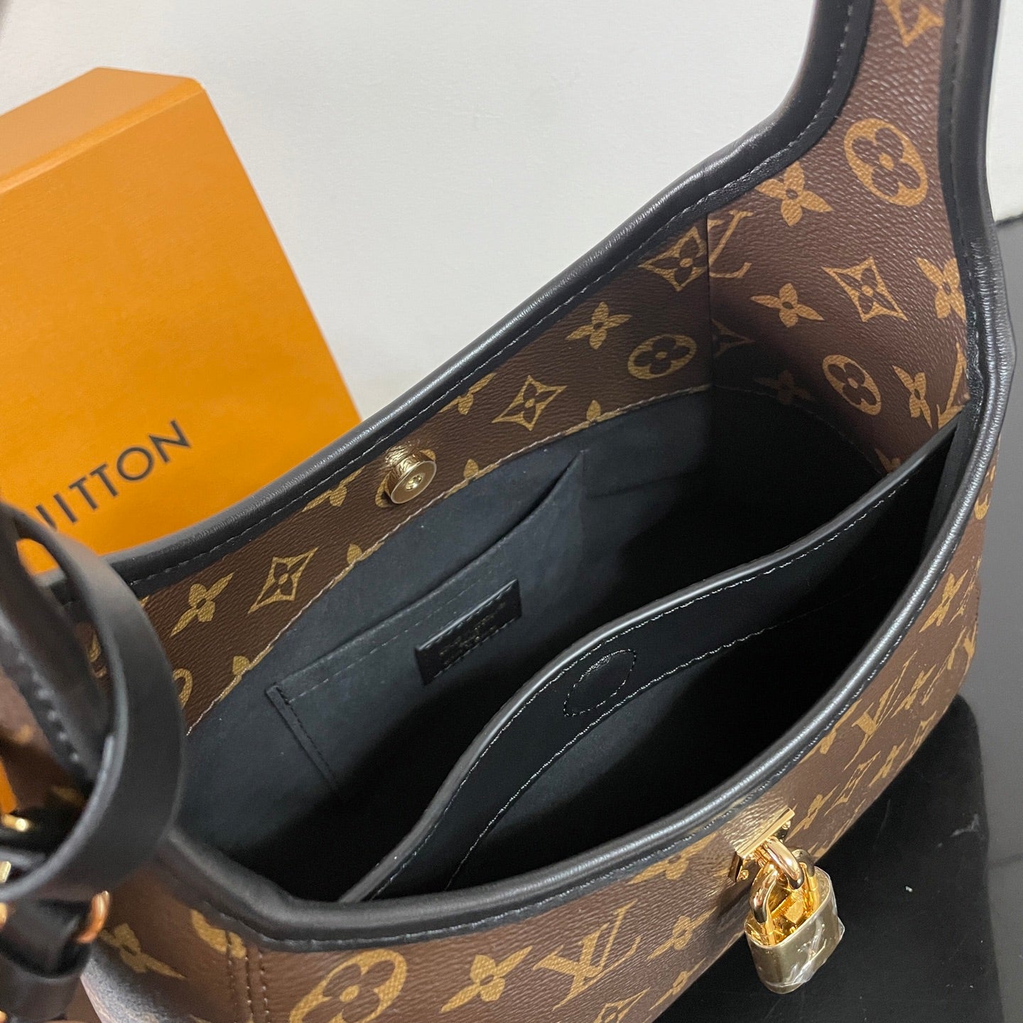 Louis Vuitton Monogram Canvas Hobo Bag With Lock Detail And Stylish Design For Fashion Fans