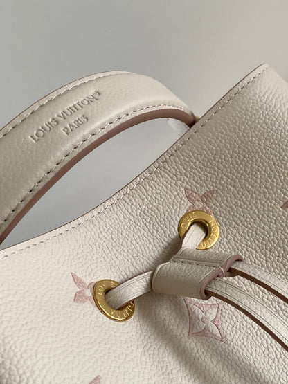 Chic Louis Vuitton White Monogram Empreinte Bucket Bag for Fashion - Forward Style