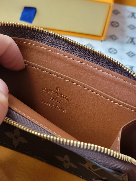 Chic Louis Vuitton Monogram Card Holder With Brown Accents And Gold Zipper M80556