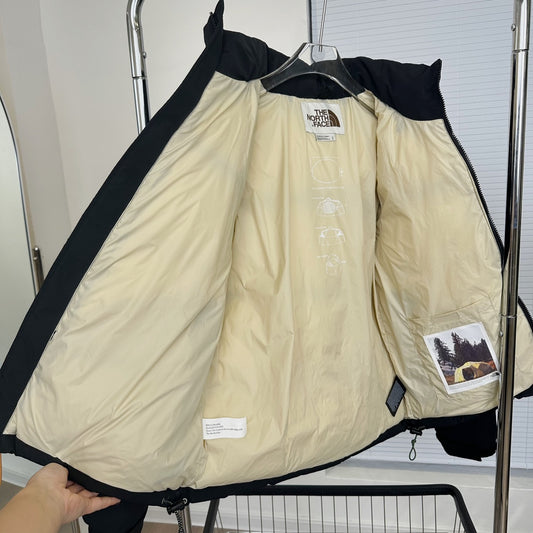 The North Face Black Nuptse Puffer Jacket With Iconic Branding And Warmth