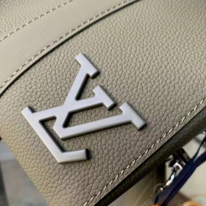 Chic Olive Green Louis Vuitton Crossbody Bag With Textured Leather And Signature Details