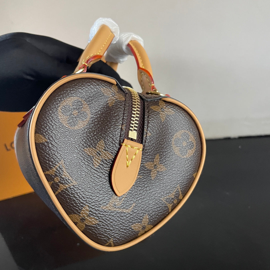 Stylish Louis Vuitton Nano Speedy Bag with Iconic Monogram and Luxe Leather Details