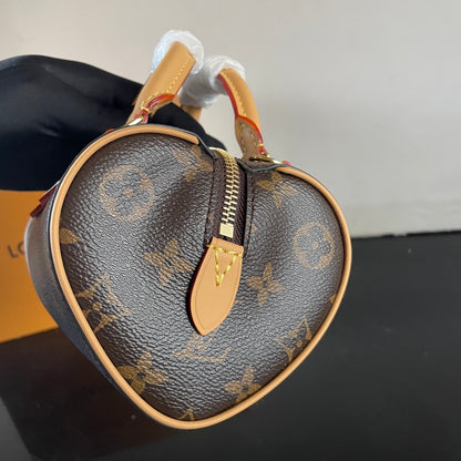 Stylish Louis Vuitton Nano Speedy Bag with Iconic Monogram and Luxe Leather Details