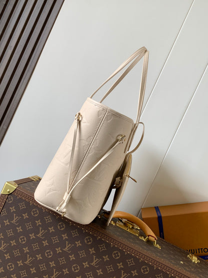 Elegant Louis Vuitton Cream Empreinte Leather Neverfull Tote Bag for Fashion Enthusiasts