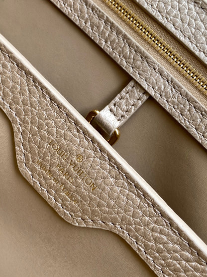 Elegant Louis Vuitton Capucines Mini Bag in Beige Grained Leather with Gold Accents