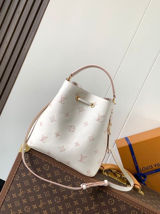 Chic Louis Vuitton White Monogram Empreinte Bucket Bag for Fashion - Forward Style