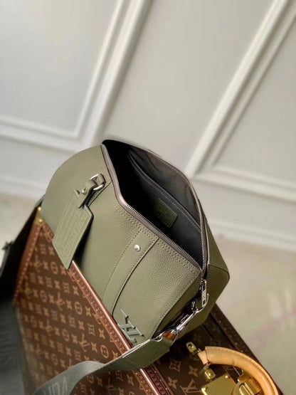 Chic Olive Green Louis Vuitton Crossbody Bag With Textured Leather And Signature Details