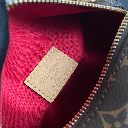 Stylish Louis Vuitton Nano Speedy Bag with Iconic Monogram and Luxe Leather Details