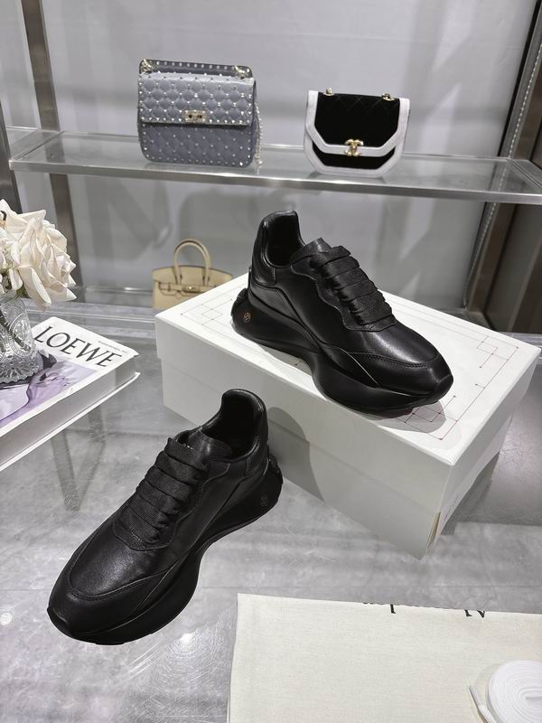 Sleek All Black Alexander McQueen Oversized Sneakers For Timeless Street Style