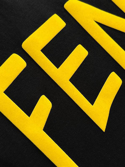 Elegant Fendi Roma White/Black T - Shirt With Bold Yellow Branding For Fashion Lovers