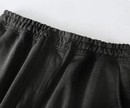 Hermès Men's Black Drawstring Shorts with Orange Brand Print