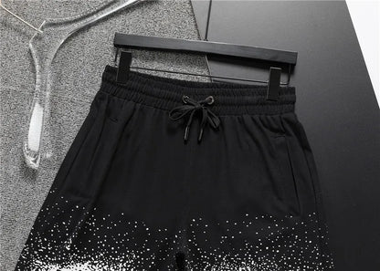 Louis Vuitton Men's Black Drawstring Shorts with White Spray Print