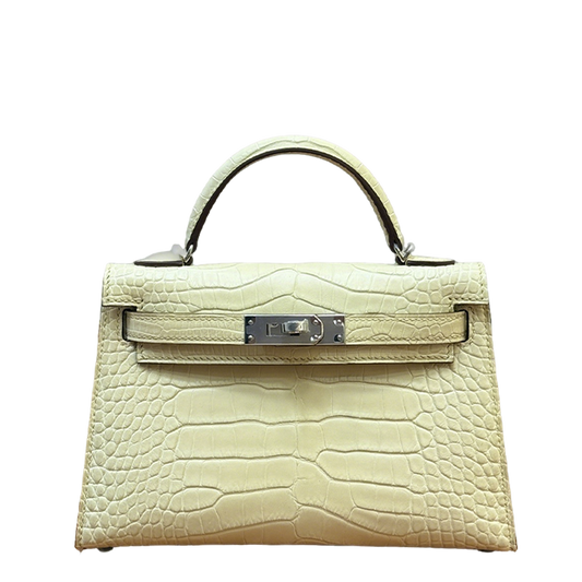 Elegant Hermès Kelly Bag in Cream Crocodile Leather with Strap 1920
