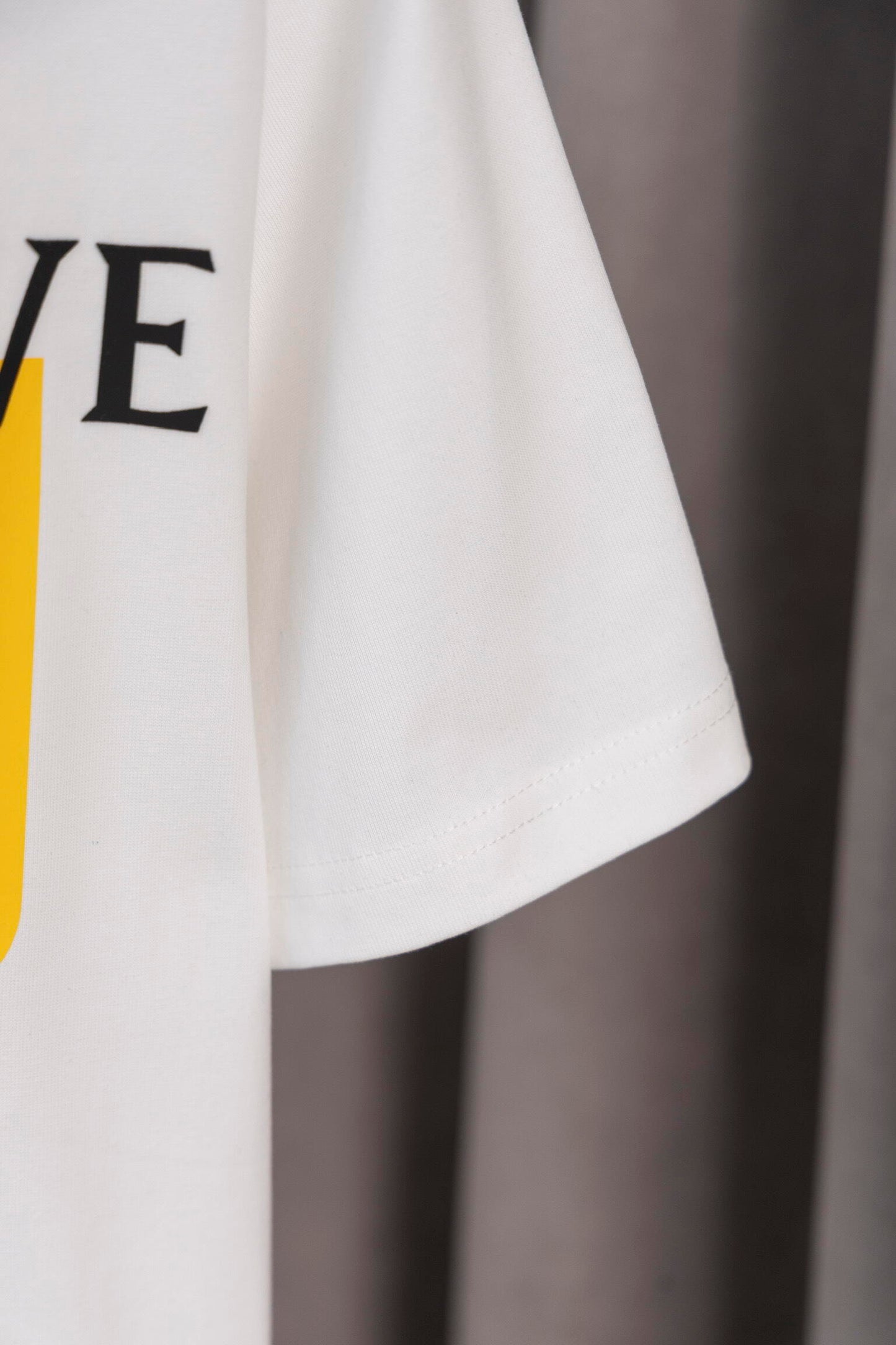 LOEWE White/Black Tee With Yellow Logo Patch For Stylish Casual Wardrobe Update