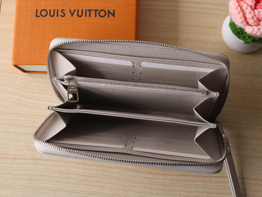 Elegant Louis Vuitton Light Gray Embossed Leather Zip Around Wallet for Luxury Enthusiasts M14228