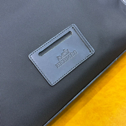 Hermès Black Canvas Briefcase With Leather Trim And Buckle Closure