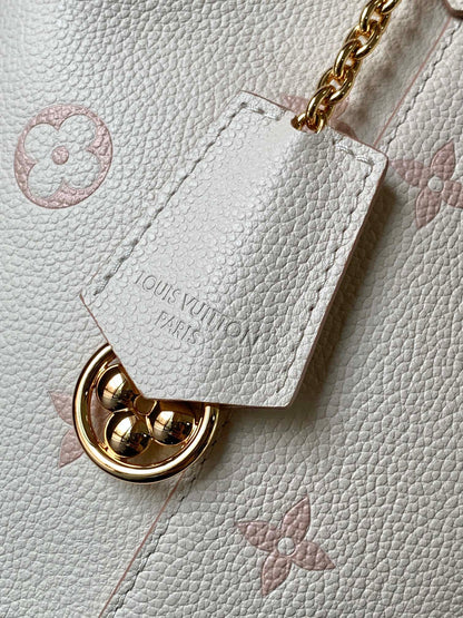 Chic Louis Vuitton White Monogram Empreinte Bucket Bag for Fashion - Forward Style