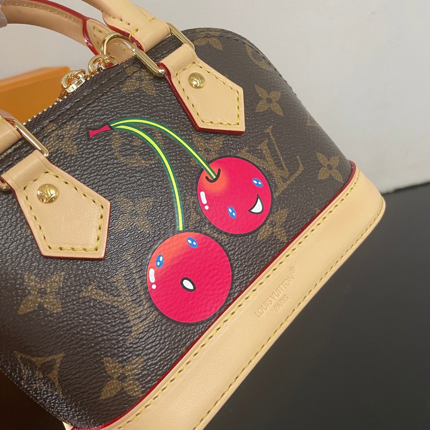 Adorable Louis Vuitton Alma BB Bag With Cherry Motif For Fashion Enthusiasts