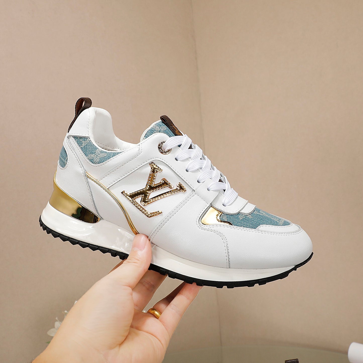Louis Vuitton Women's White Sneakers With Blue Patterns And Gold Accents