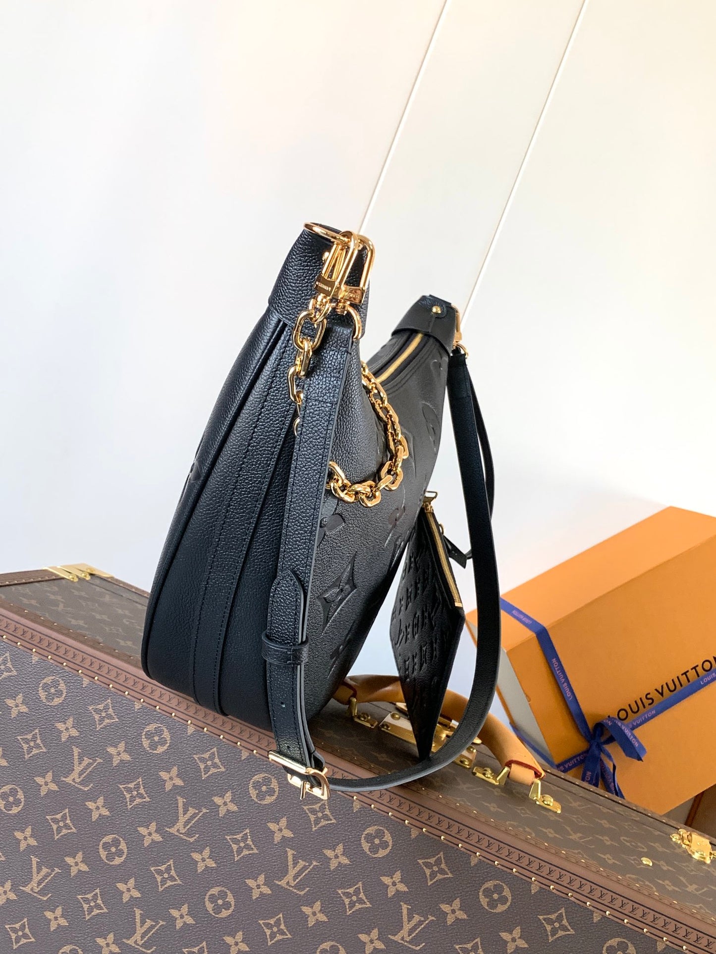 Louis Vuitton Black Embossed Leather Moon Bag With Gold Chain Stylish Luxury Shoulder Accessory