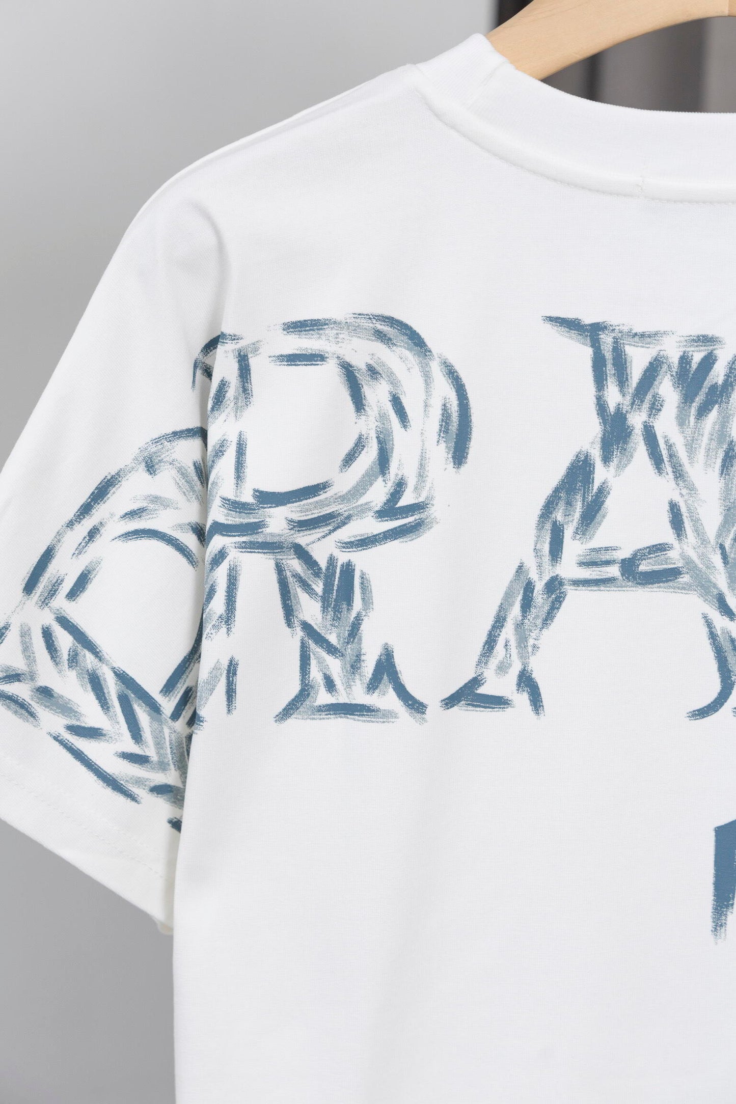 Prada Black/White Tee With Iconic Triangle Logo For Sophisticated Streetwear Looks