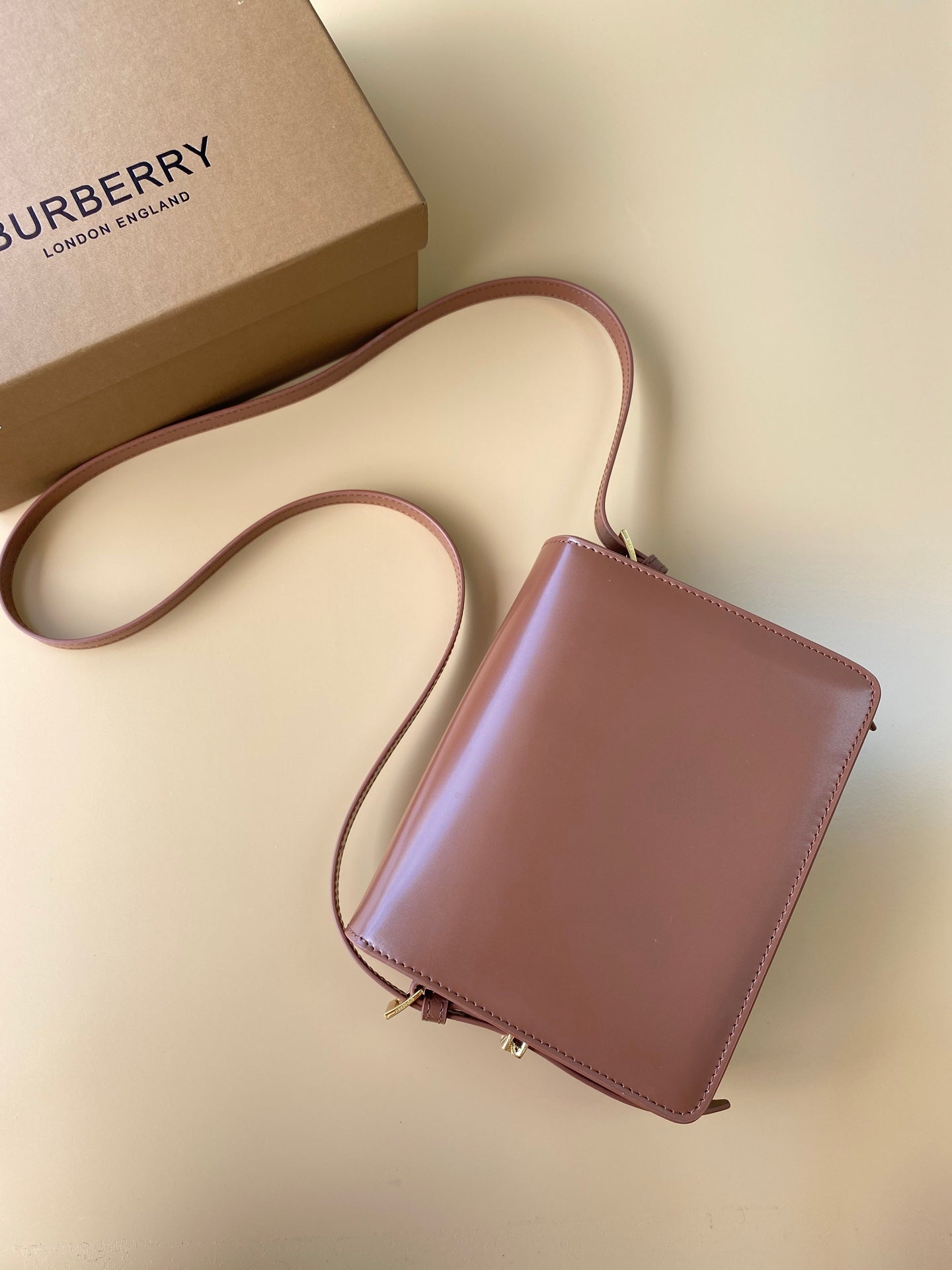 Elegant Black/Brown Burberry Crossbody Bag With Gold Branding And Adjustable Strap Style No.595155