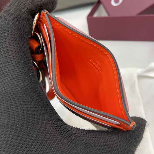 Chic Gucci Card Holder With Signature GG Pattern Orange Accents And Wrist Strap 819121
